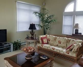 Stylish rattan couch; handsome coffee table with matching end table & foyer table