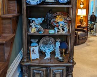 Woo hoo! Nothing screams 1980 like a large wooden etagere, filled with family treasures and heirlooms. There are some delft plates, Royal Doulton bird figurines, Asian porcelains and majolica ware. 