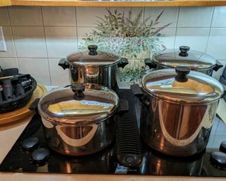 Nice set of vintage Revere Ware cookware, baskets of kitchen things you never knew you could live without.