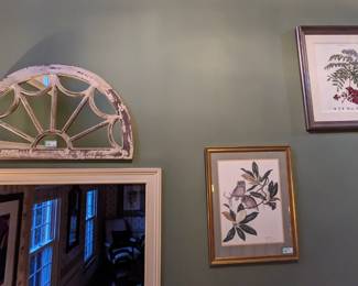 Arch mirror and pair of framed botanicals.