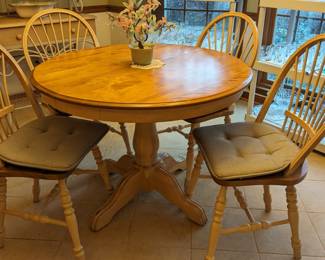 Sweet little wooden breakfast table, by Muebles Canadel, Inc, with four matching chairs and two leaves so that you can invite all of your neighbors for meals (except for THEM) Asian jade bonsai tree and shelving units with stemware and lot's of sparkly thangs. 