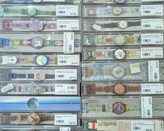 Nice collection of vintage Swatch Swiss watches, in cases.