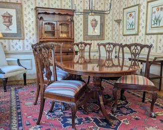 Gorgeous flame mahogany double pedestal dining table, made by Bevan Funnell, Ltd. , England, set/6 matching mahogany side chairs, nicely framed art, pair of upholstered armchairs, antique mahogany teacart, by Lakeside Craft Shops, Sheboygan, WI, and mahogany chest, by Councill Craftsmen, all atop an antique hand-woven Persian Bakhtiari rug, measuring 10' x 12' 2".
