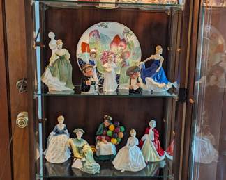 Lighted curio cabinet with Royal Doulton figurine collection. Bring your shopping carts!
