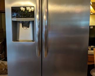 While we're in the kitchen, let's talk about that stainless steel refrigerator - it's for sale!                                                    It's a Frigidaire/Electrolux model # FGSHS2631PF4A, 25.6-cu ft. side-by-side refrigerator with ice maker (fingerprint resistant stainless steel) ENERGY STAR