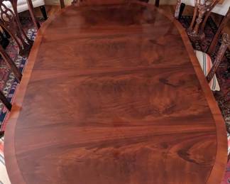 Beautiful flame mahogany veneer on this rare English banded mahogany dining table, by Bevan Funnell, Ltd.