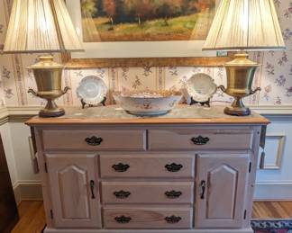 Painted wood buffet, with natural wood top, pair of brass urn table lamps, w/Shades, finials, antique English porcelain bowl, pair of plates and nicely framed contemporary art.