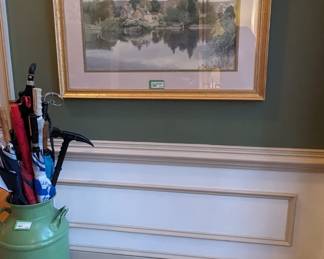 Vintage metal milk can, filled with golf umbrellas, walking canes and a deadly pick thing and a nicely matted/framed original artwork.