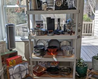 Pots and pans, vintage bundt cake pans, stainless steel cookware, cooling racks, etc.