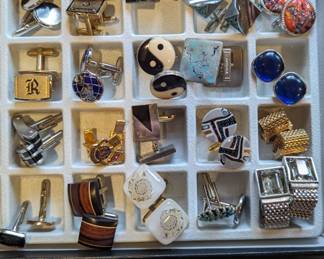 More men's cufflinks and tie tacks.