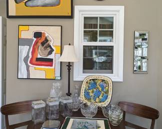 Pair of original oils on canvas, by Dunwoody artist, Amy Dandy, contemporary wooden breakfast table with pair of matching chairs, by Noble House Home Furnishings, assortment of Willow Springs crystal golf trophies, hand-painted ceramic platter (made in Tuscany by CeramicaGeometrieSrl located in Greve in Chianti), multi-faceted wall mirror and wall clock "Le Chat Noir", by Rodolphe Salis.