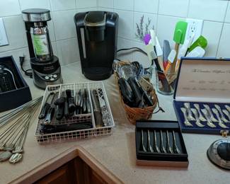 One of several coffee makers, an electric martini shaker, backyard barbecue skewers, Brookstone connoisseur's wine gadget kit and a couple of boxes of spoons, given decades ago as wedding gifts, but never used. 
