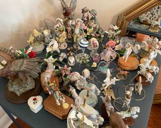 hummingbird figurines, carousels and/or horse figurines, ceramic flowers, ceramic eggs, duck figurine, eagle figurine