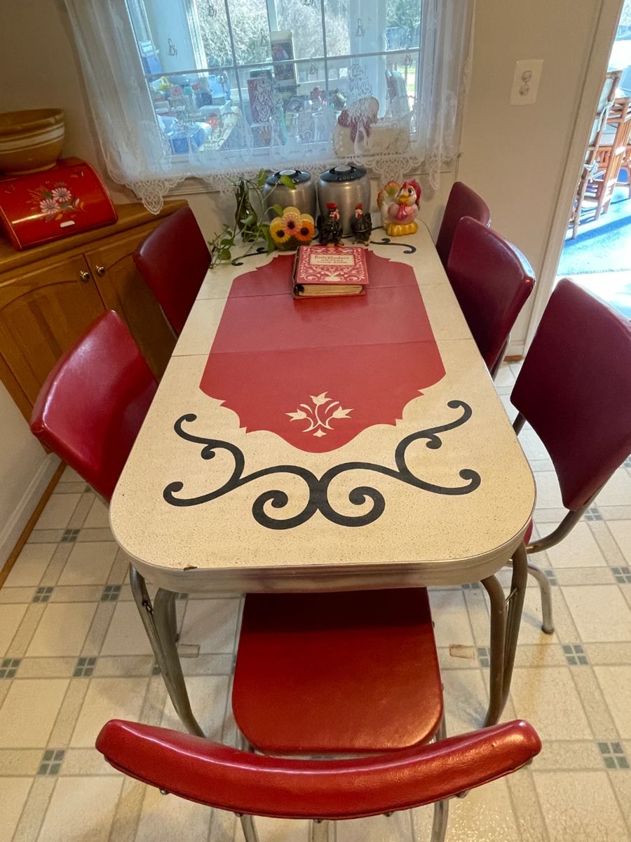 Vintage 1950s formica and chrome expandable table (leave inserted), and set of 6 vinyl and chrome chairs.