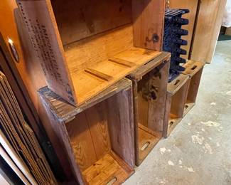 Vintage beverage crates, including Pepsi, Logis du May Cognac and District Hotel Supply Company.