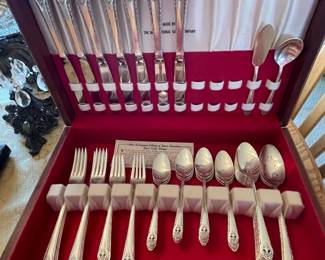 Holmes and Edwards silver-plated flatware 51-piece set, including serving pieces and original storage box.