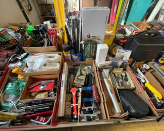 Mixed lot of tools and hardware for electrical and plumbing work, as well as other projects.