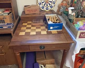 Chess/checkers game table with ceramic chess pieces.