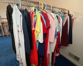 Vintage women's clothing, including dresses, slacks, tops, suits and blazers.