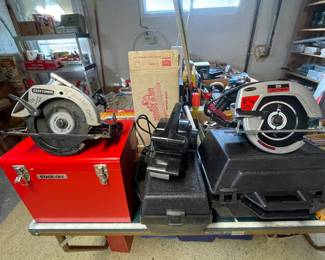 Craftsman saws and sander with storage cases.
