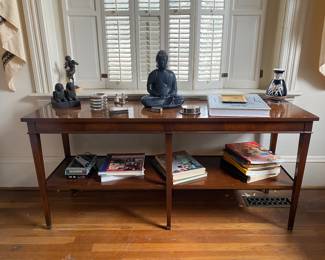 Foyer tables, books, coasters, bookends, cherub statue