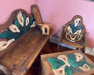 Mexican wooden garden, benches and trunk with canna lilies