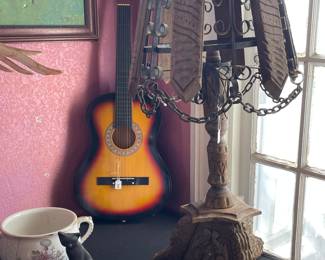 Primitive lamp, many many horns, and instruments