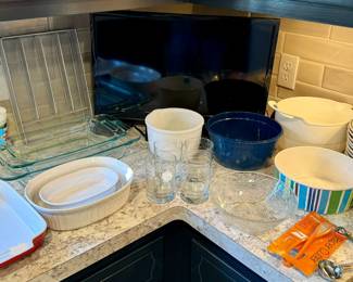 Sanyo TV amongst cooking and serving ware.