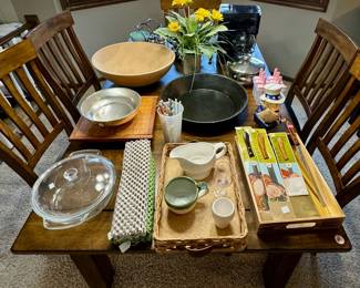 Dishes, Bowls, Knives, and a Vintage Cast Iron Uncle Sam Piggy Bank…all on a stylish Wooden Dinner Table (w/ 6 Chairs)