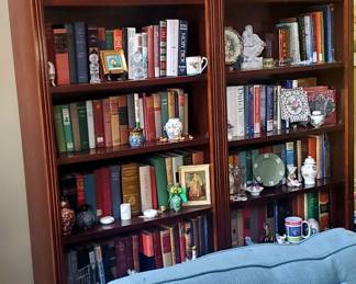 The sofa is not part of the sale...bookcase and books are.