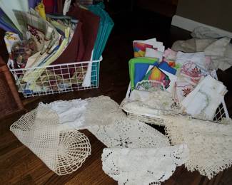 Numerous place-mats and linens