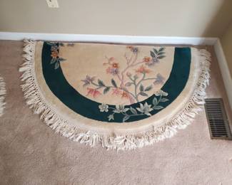 (1) of (2) half-circle plush carved rugs...