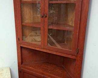 Primitive corner cabinet