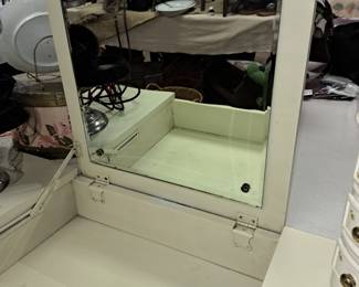 With pop up mirror and makeup compartment 