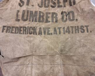 "St. Joseph Lumber Co. Frederick Ave. At 14th St." apron