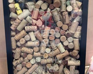 Wine corks in a wood shadow box