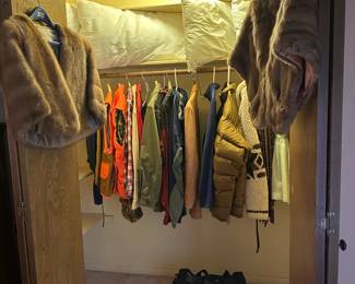 Bedroom # 1 closet consists of a few number of mens' pieces as well as retro childrens' dresses and furs.  And pillows.  Because they have to go somewhere.