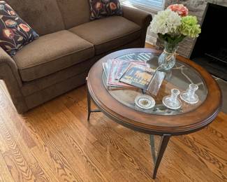 loveseat and wood and glass coffee table