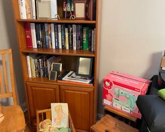 bookcase with lower cabinet, vintage doll bed with vintage prints, crates and more