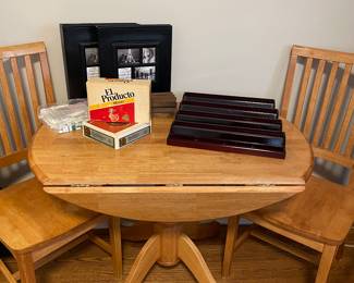 drop leaf oak table and 2 chairs; vintage cigar boxes and games