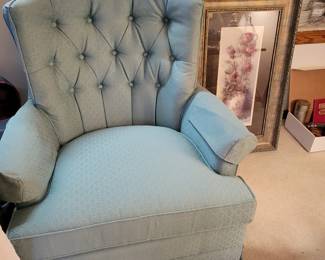 Two matching arm chairs and one matching ottoman.