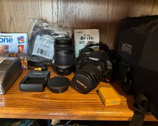 Canon EOS Rebel T1i digital camera with accessories.
