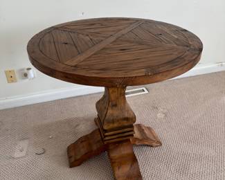 round wooden pedestal table