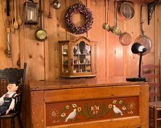 WALL OF PRIMITIVES AND BLANKET CHEST