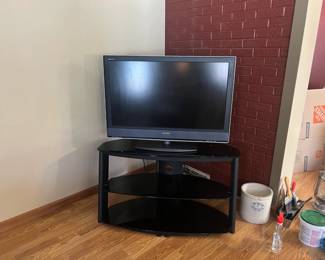 Sony Bravia TV and glass tv stand.