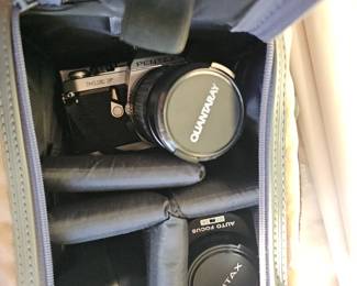 Pentex 35mm camera with lenses and lighting. In carrying case.