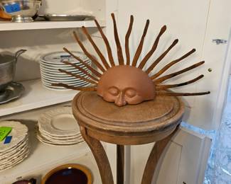 Two plant stands and a sun mad from metal.