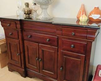 Buffet with black marble top.
Felt lined silverware drawers