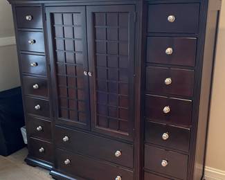 Stylish multi drawer storage cabinet 65” wide x 63.5” tall X 20” deep at widest points. 