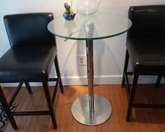 bar  height glass  top  table and  two  chairs